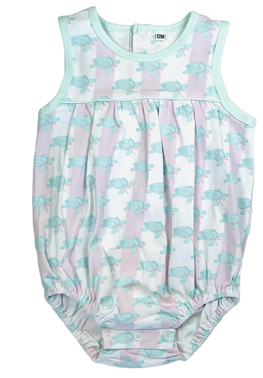 A sleeveless baby romper with a white base, light pink vertical stripes, and a repeating light blue sea turtle pattern. It features mint green trim and elasticated leg cuffs.